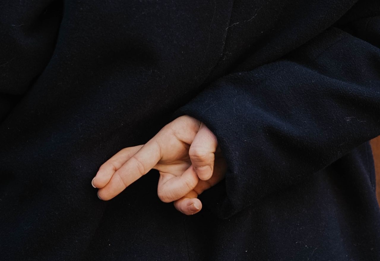 Is it legal or ethical to hire a ghostwriter? Crossed fingers