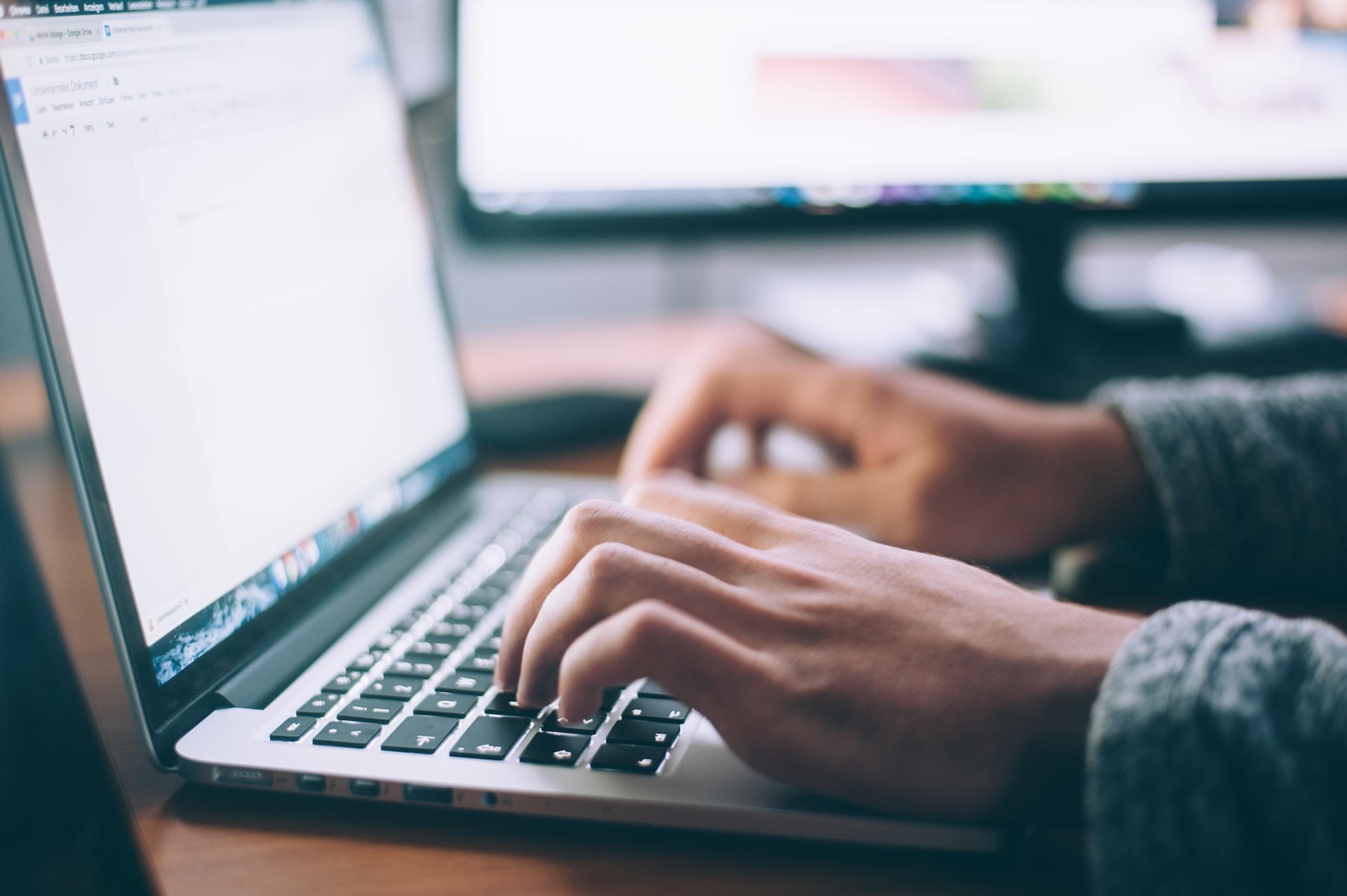 man typing at keyboard by Glen Peters on Unsplash